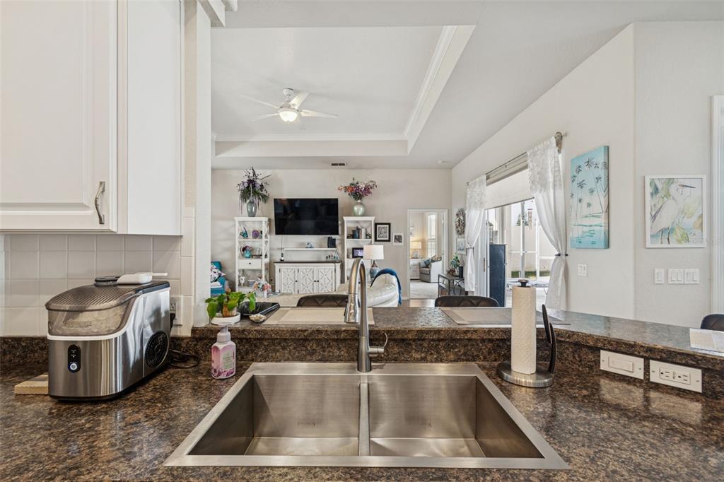 5287 Slater Road Spring Hill, FL 34608 - Photo 21 of 86 a kitchen with a sink microwave and cabinets