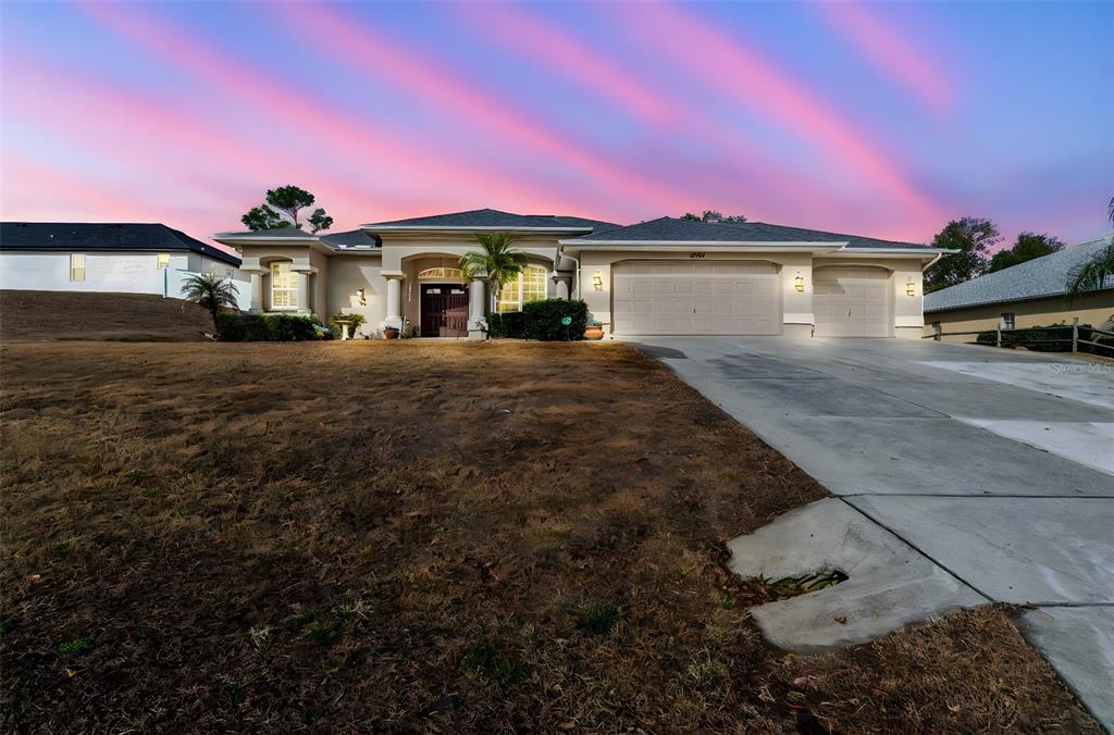 5287 Slater Road Spring Hill, FL 34608 - Photo 3 of 86 a front view of a house with a yard