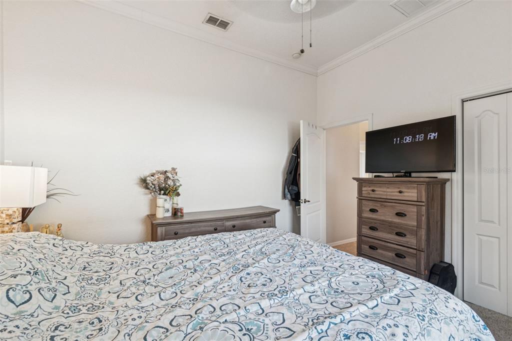 5287 Slater Road Spring Hill, FL 34608 - Photo 44 of 86 a bedroom with a bed and a television