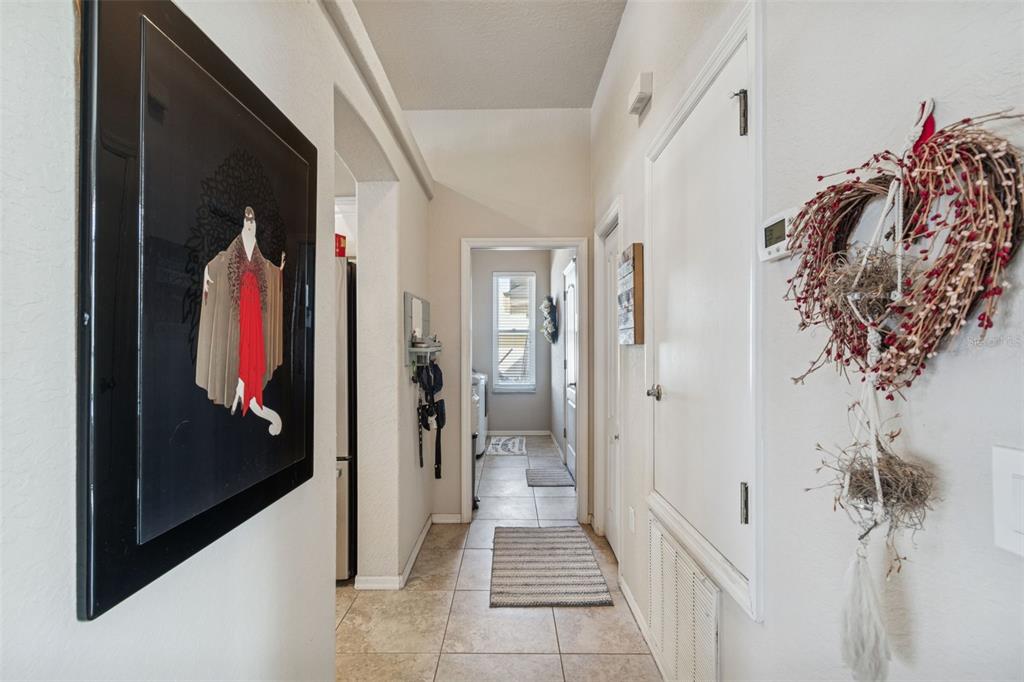 5287 Slater Road Spring Hill, FL 34608 - Photo 45 of 86 a view of a hallway with wooden floor and stairs