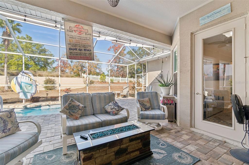5287 Slater Road Spring Hill, FL 34608 - Photo 55 of 86 a living room with furniture and a potted plant