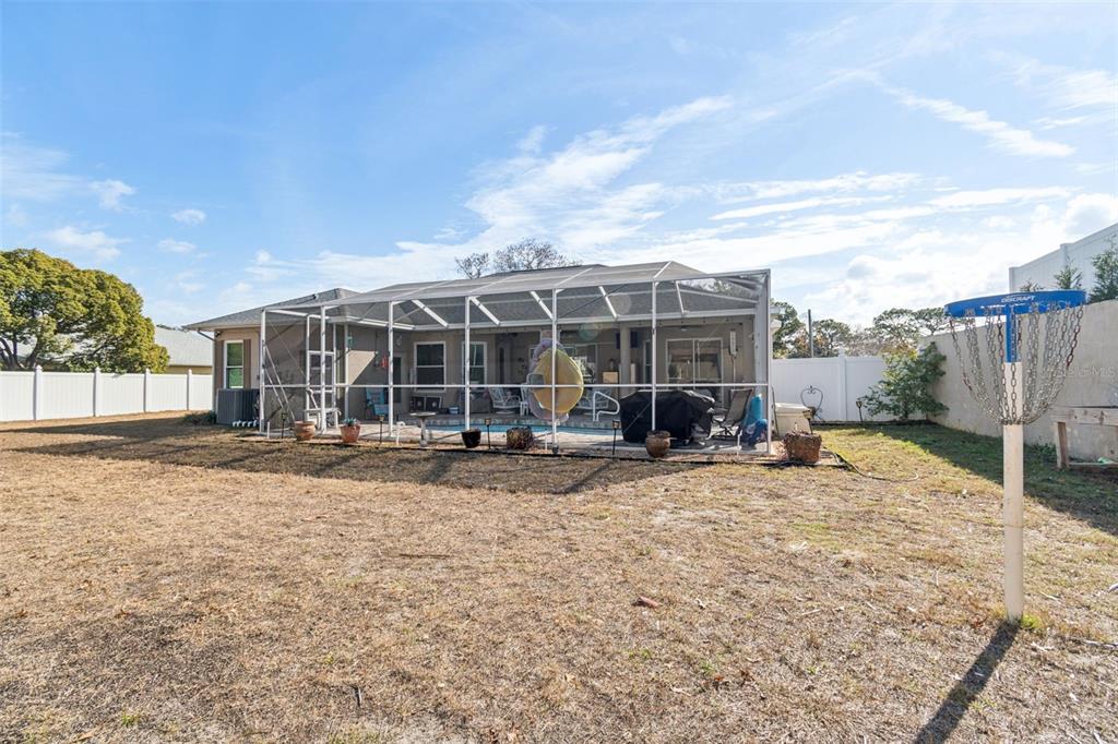5287 Slater Road Spring Hill, FL 34608 - Photo 66 of 86 a view of a house with backyard porch and sitting area