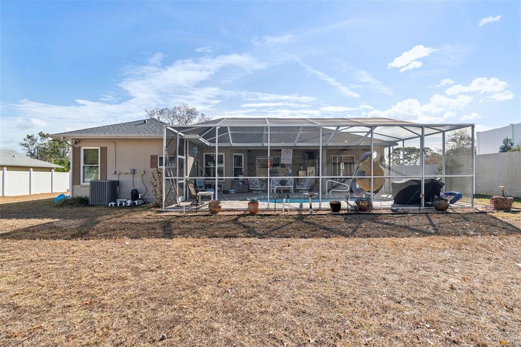 5287 Slater Road Spring Hill, FL 34608 - Photo 67 of 86 a front view of a house with a yard and garage