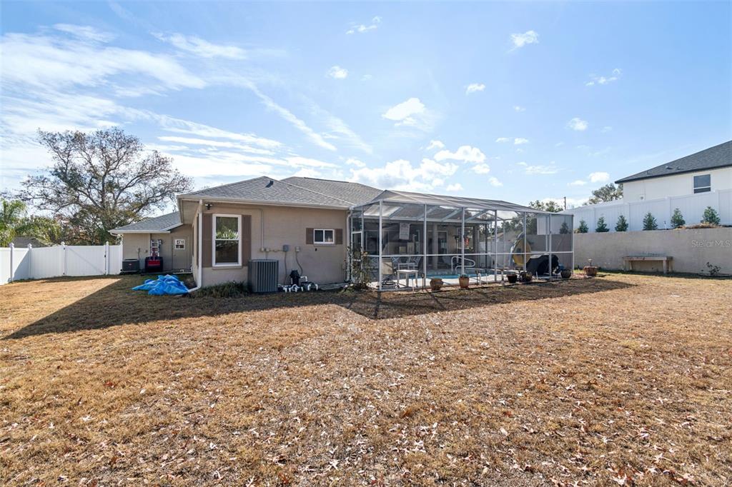 5287 Slater Road Spring Hill, FL 34608 - Photo 68 of 86 a view of a house with a yard and garage