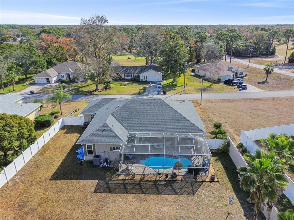 5287 Slater Road Spring Hill, FL 34608 - Photo 86 of 86 an aerial view of a house with swimming pool and patio