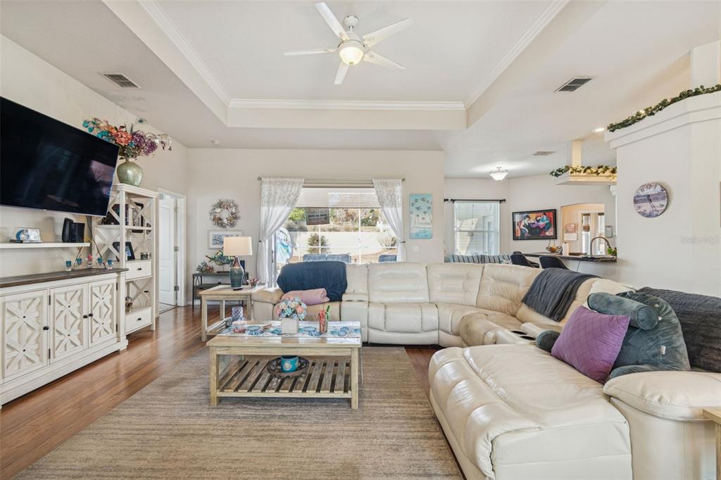 5287 Slater Road Spring Hill, FL 34608 - Photo 9 of 86 a living room with furniture and a flat screen tv