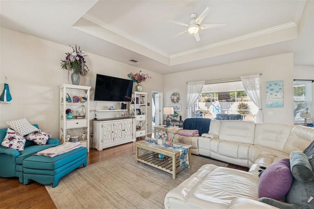 5287 Slater Road Spring Hill, FL 34608 - Photo 10 of 86 a living room with furniture and a flat screen tv