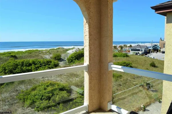 a view of a forest from a balcony