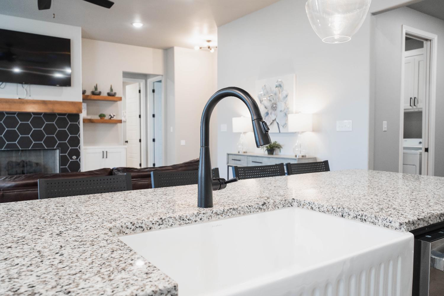 5921 Harvard Street Lubbock, TX 79416 - Photo 15 of 34 a living room with a couch and a flat screen tv