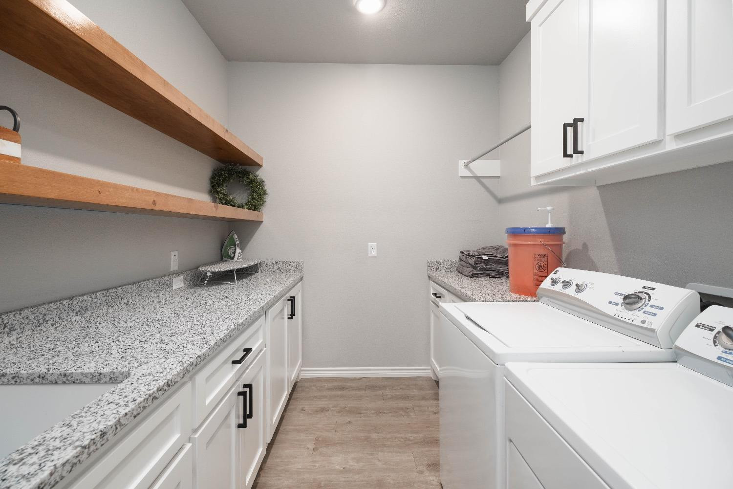 5921 Harvard Street Lubbock, TX 79416 - Photo 32 of 34 a utility room with dryer and washer