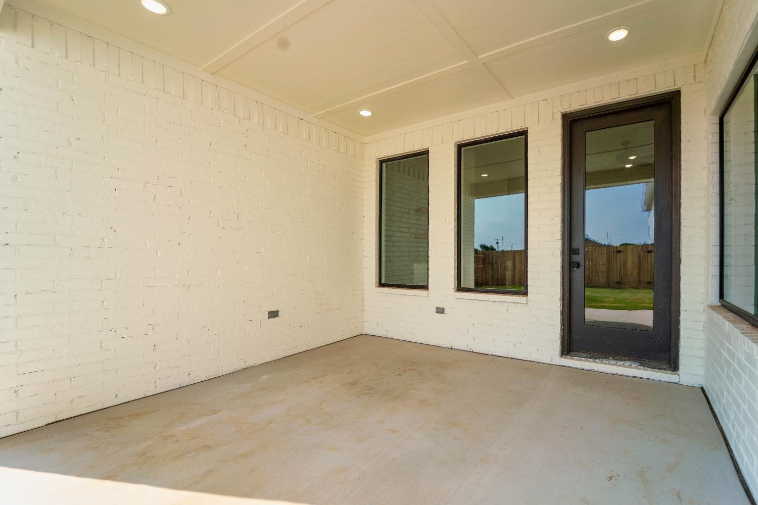 5921 Harvard Street Lubbock, TX 79416 - Photo 33 of 34 a view of an empty room with a window