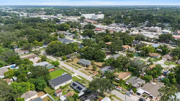 an aerial view of residential houses with outdoor space