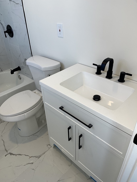 136 Houston Street Providence, RI 02905 - Photo 8 of 15 a bathroom with a sink and a toilet