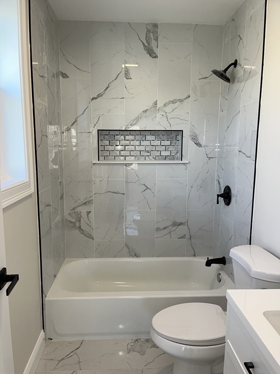 136 Houston Street Providence, RI 02905 - Photo 9 of 15 a bathroom with a toilet and a bath tub