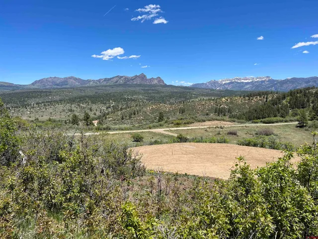 a view of lake with mountain in the background