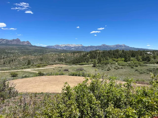 a view of lake with green space