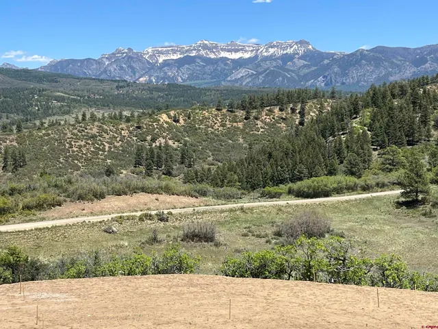 a view of a lake with mountains in the background