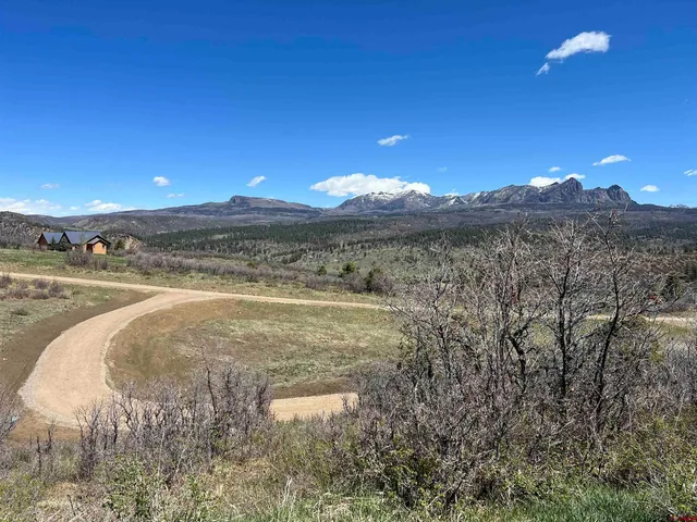 a view of a water with a mountain in the background