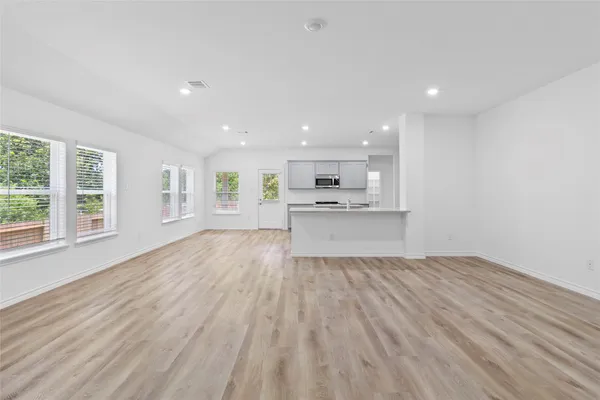 a view of kitchen and wooden floor