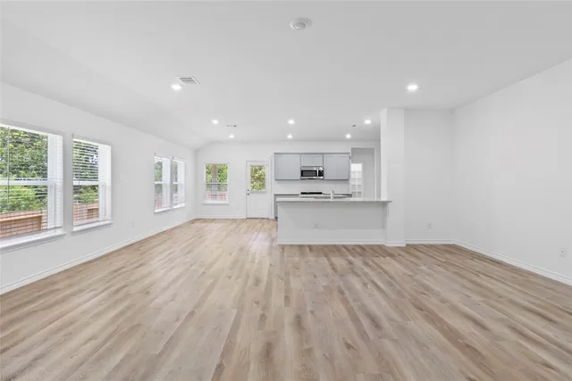 a view of kitchen and wooden floor