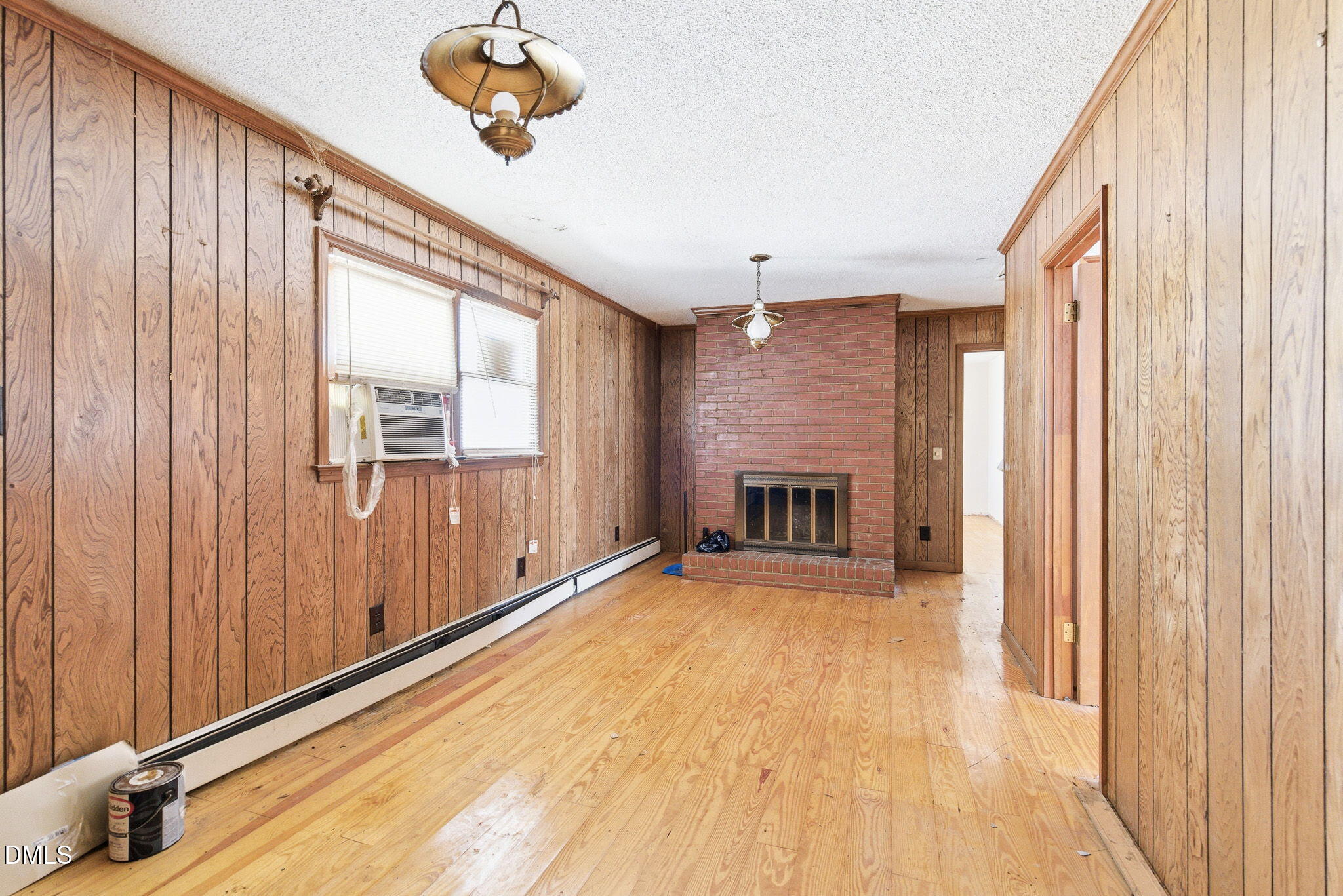 1603 Sykes Road Mebane, NC 27302 - Photo 20 of 45 a view of an empty room with a fireplace and a window