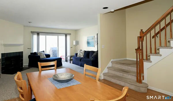 a view of a livingroom with furniture and a flat screen tv