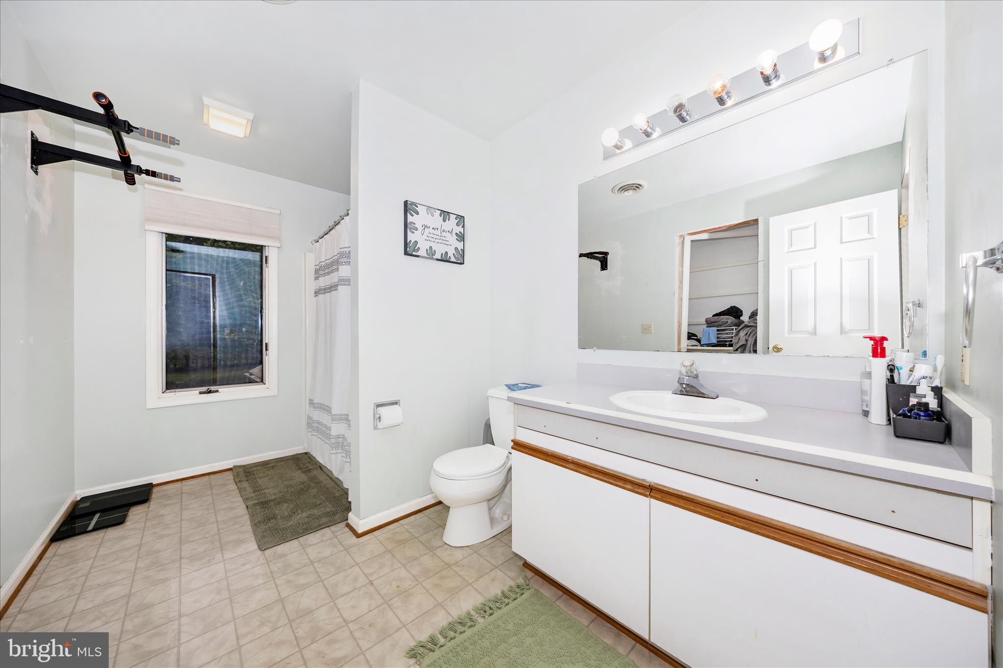 15749 Spade Road Hagerstown, MD 21740 - Photo 21 of 23 a bathroom with a granite countertop sink mirror vanity and toilet