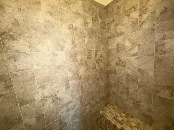 a bathroom with a sink vanity and mirror