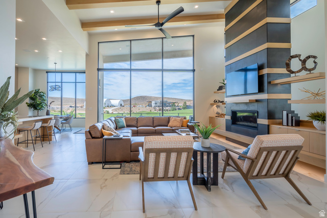 3606 South Cypress Road Hurricane, UT 84737 - Photo 11 of 69 Living area featuring a tiled fireplace, ceiling fan, and recessed lighting