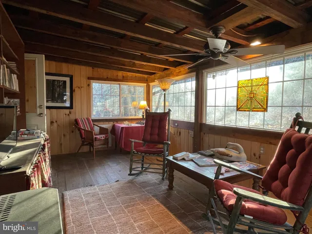 a room with gym equipment and a flat screen tv