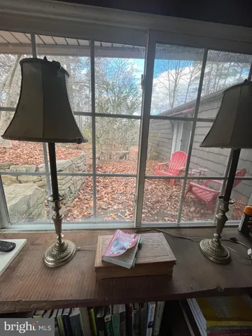 a view of balcony with wooden floor and outdoor seating