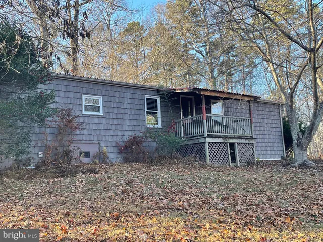 a kitchen with stainless steel appliances granite countertop a stove refrigerator and a microwave oven