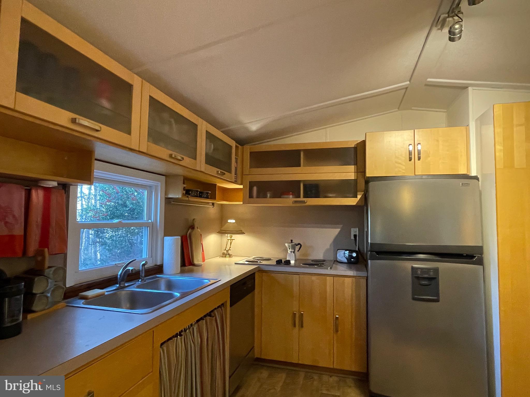 59 Angel Kiss Lane Castleton, VA 22716 - Photo 5 of 18 a kitchen with refrigerator and window
