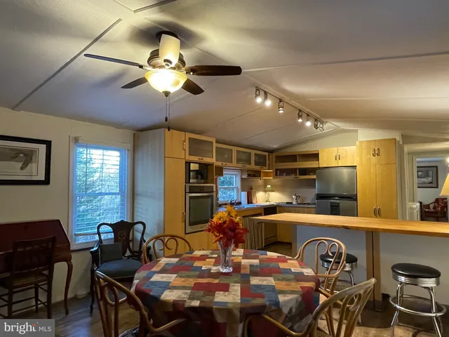 a room with a lots of furniture and window