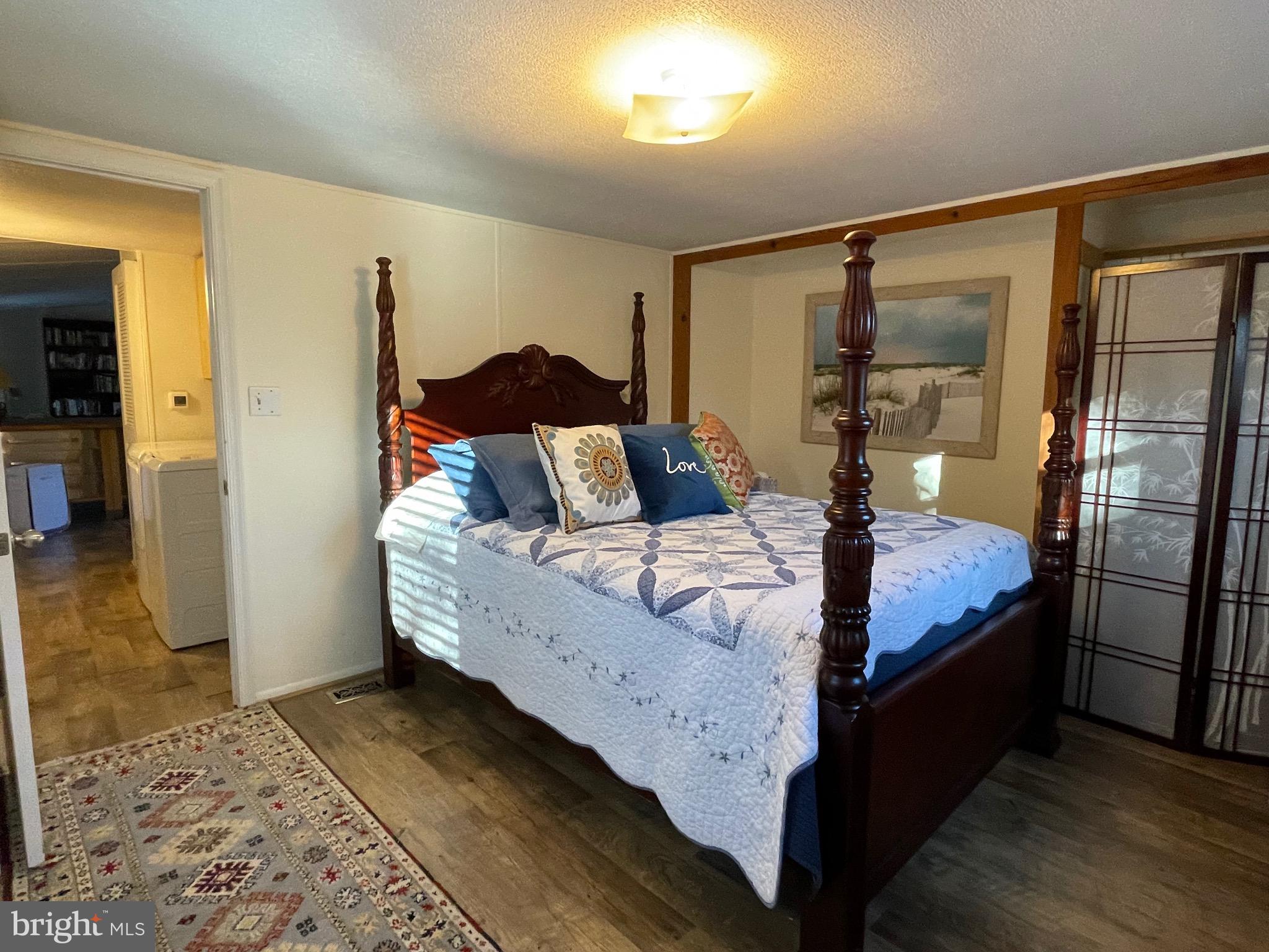 59 Angel Kiss Lane Castleton, VA 22716 - Photo 10 of 18 a bedroom with a bed and wooden floor