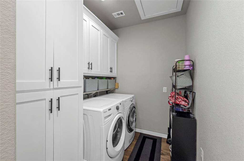 210 Stevens Street Bridgeport, TX 76426 - Photo 15 of 31 So much storage is this laundry room plus the pull down attic access above!