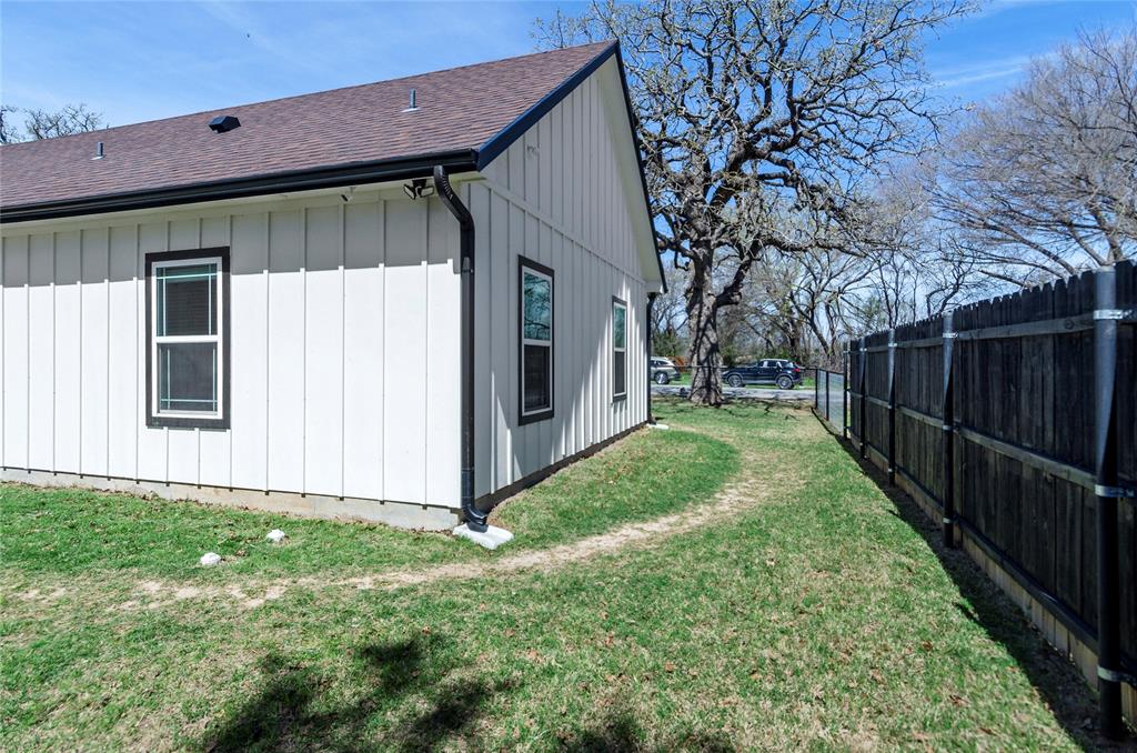 210 Stevens Street Bridgeport, TX 76426 - Photo 23 of 31 The front and back yard are fully fenced, plus the privacy fence on the street side is a great idea!