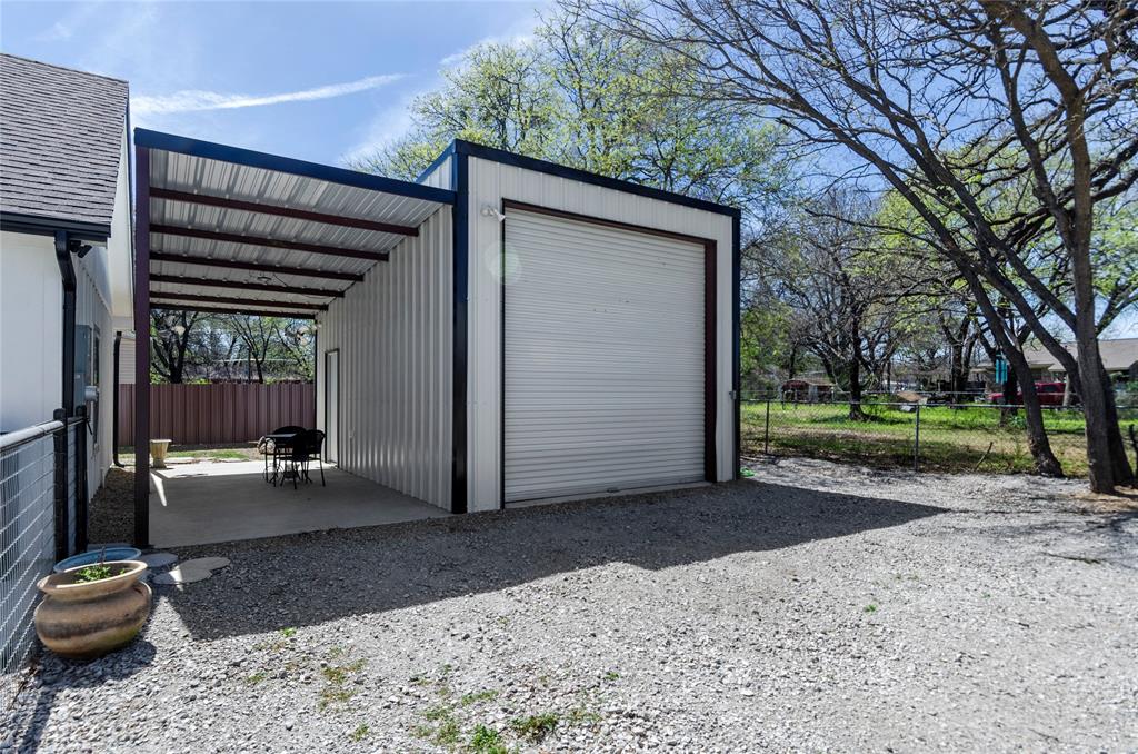 210 Stevens Street Bridgeport, TX 76426 - Photo 30 of 31 Garage, workshop, RV 50 amp hook up whatever you need this space to be it is a highly desired addition here in Wise County!