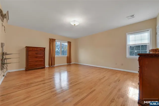 a view of a livingroom with wooden floor