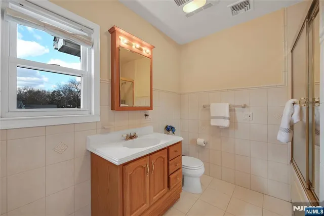 a bathroom with a tub and shower