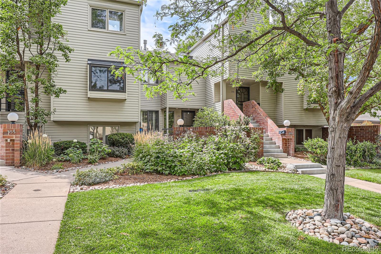 357 Harrison Street Denver, CO 80206 - Photo 1 of 40 a front view of a house with a yard and porch