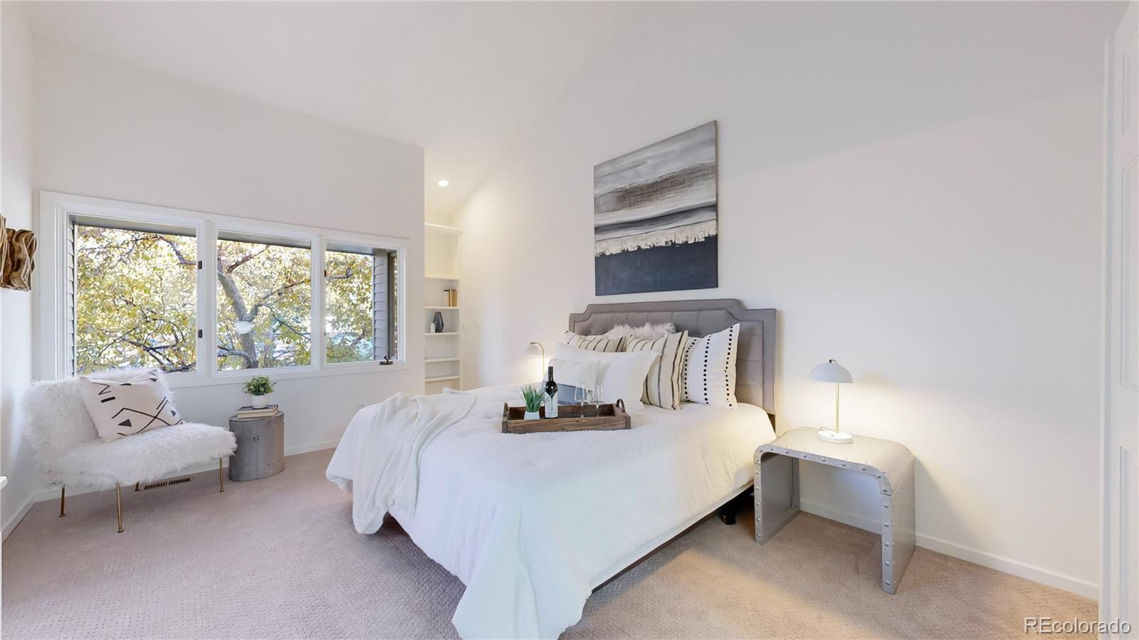 357 Harrison Street Denver, CO 80206 - Photo 11 of 40 a bedroom with a bed and a large window