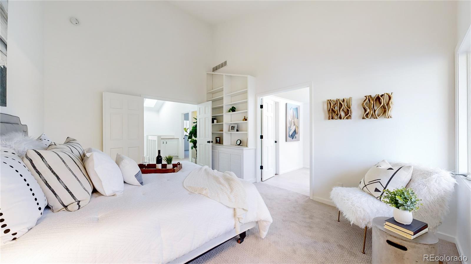 357 Harrison Street Denver, CO 80206 - Photo 12 of 40 a bedroom with a bed and a couch