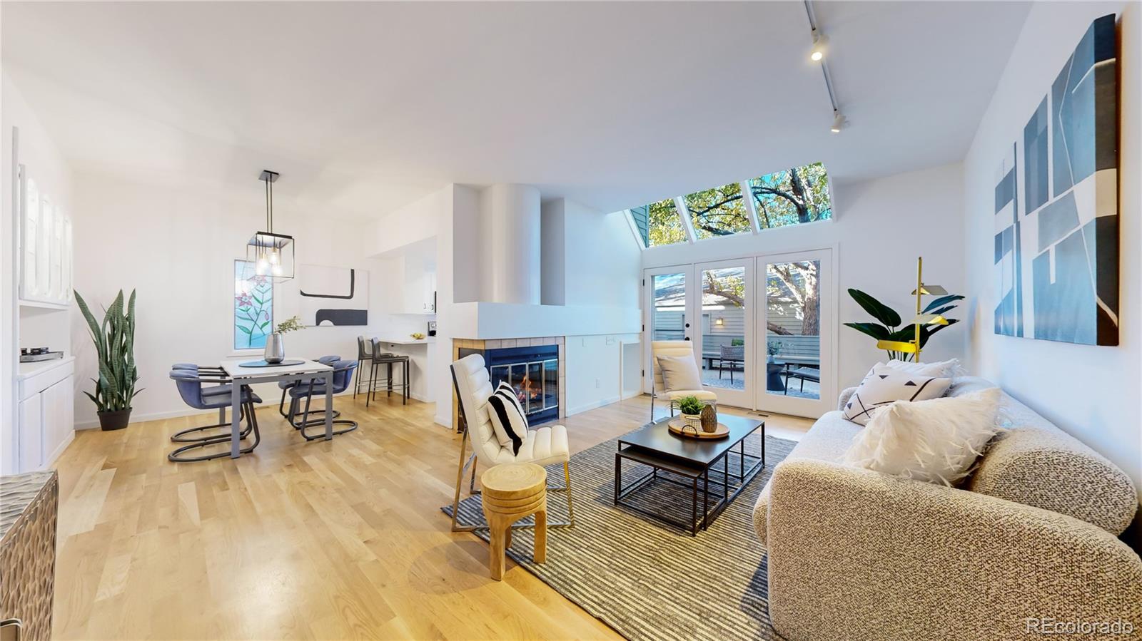 357 Harrison Street Denver, CO 80206 - Photo 2 of 40 a living room with furniture and wooden floor