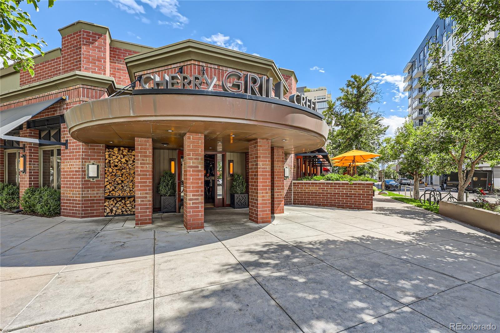 357 Harrison Street Denver, CO 80206 - Photo 28 of 40 a front view of a building with retail shops