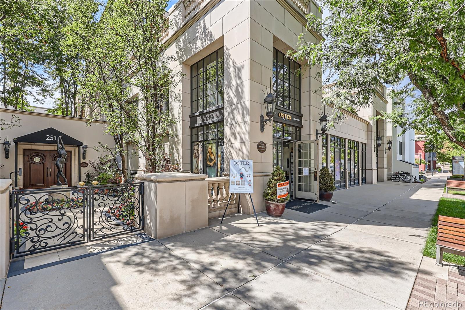 357 Harrison Street Denver, CO 80206 - Photo 35 of 40 a view of a street with a cars parked in front of it