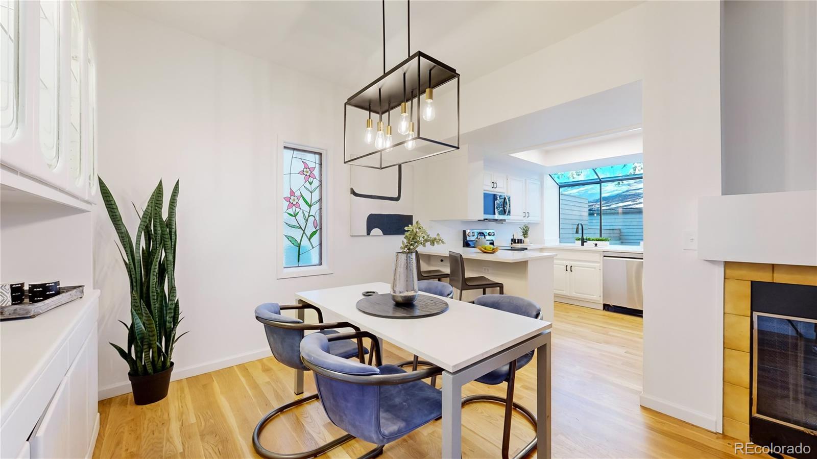 357 Harrison Street Denver, CO 80206 - Photo 5 of 40 a view of a dining room with furniture window and wooden floor