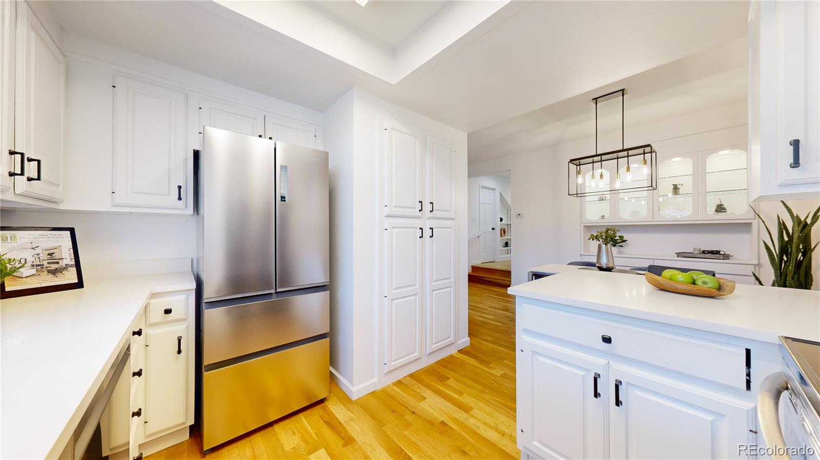 357 Harrison Street Denver, CO 80206 - Photo 9 of 40 a kitchen with stainless steel appliances granite countertop a refrigerator and a sink