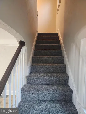 a bathroom with a sink toilet and mirror