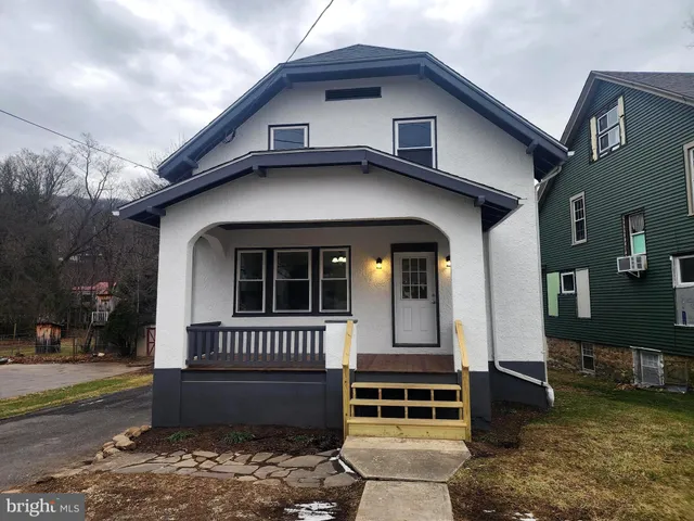 a living room with a fireplace